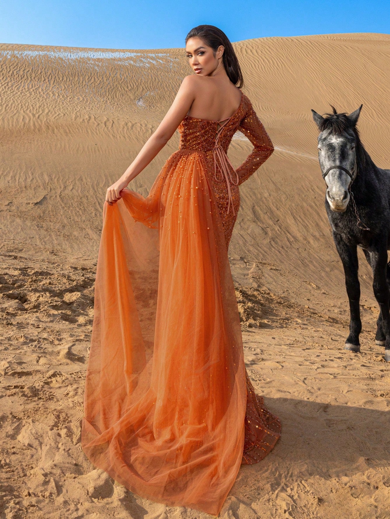 Elegant One-Shoulder Beaded Evening Gown with Dramatic Long Sleeves, Back-Bow Accent, High-Thigh Slit & Cascading Side Panel Mermaid Dress